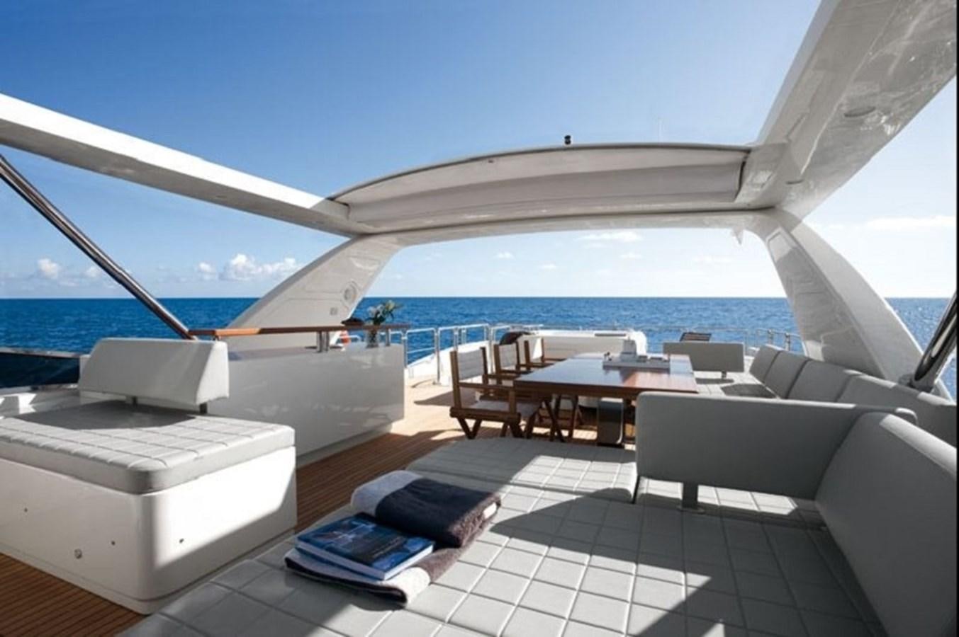 a room with a large white sofa and a large white lounge chair aboard AZ 88 Yacht for Sale