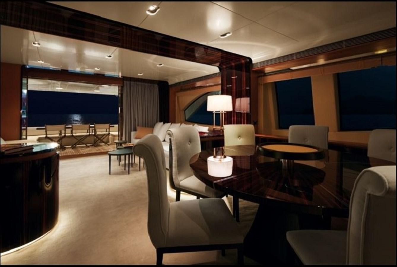 a room with a table chairs and a tv aboard AZ 88 Yacht for Sale
