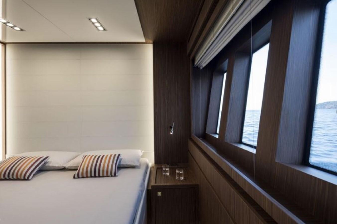 a bed in a room aboard OXIDANTE Yacht for Sale