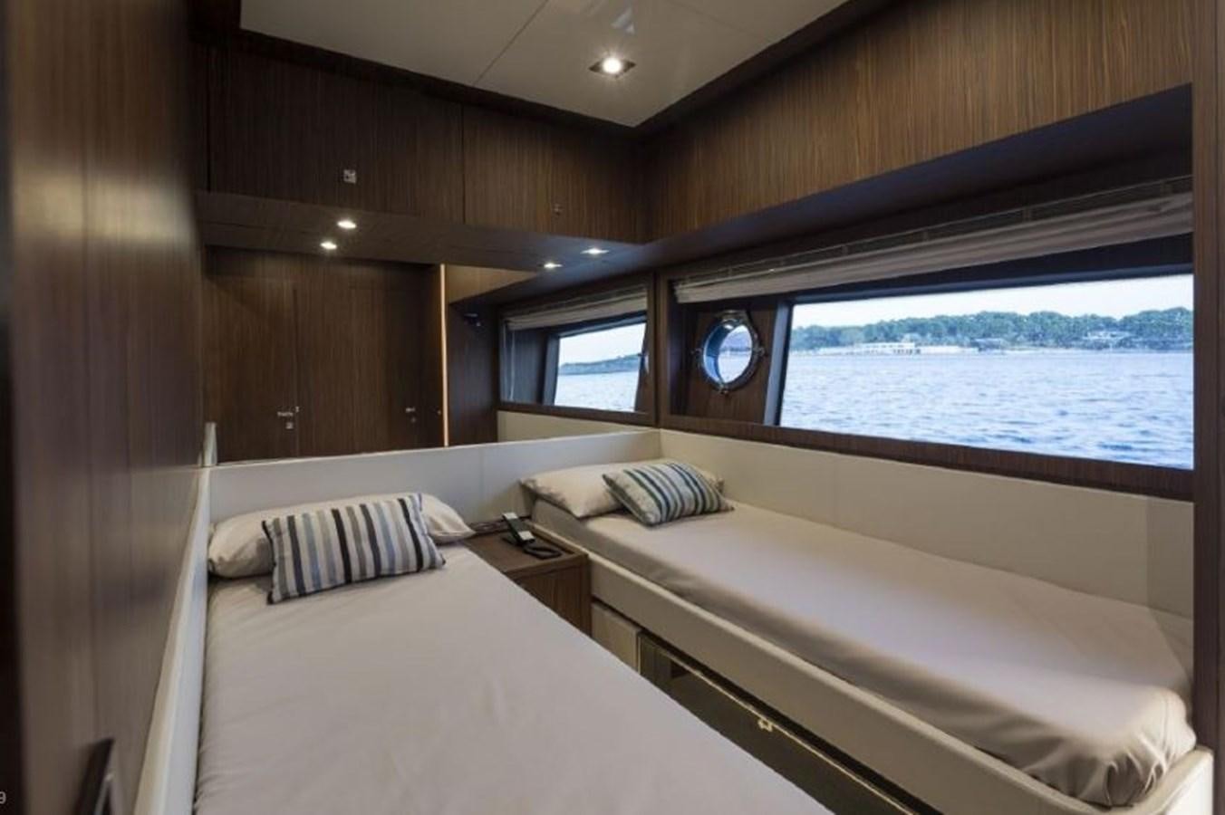 a room with two beds aboard OXIDANTE Yacht for Sale