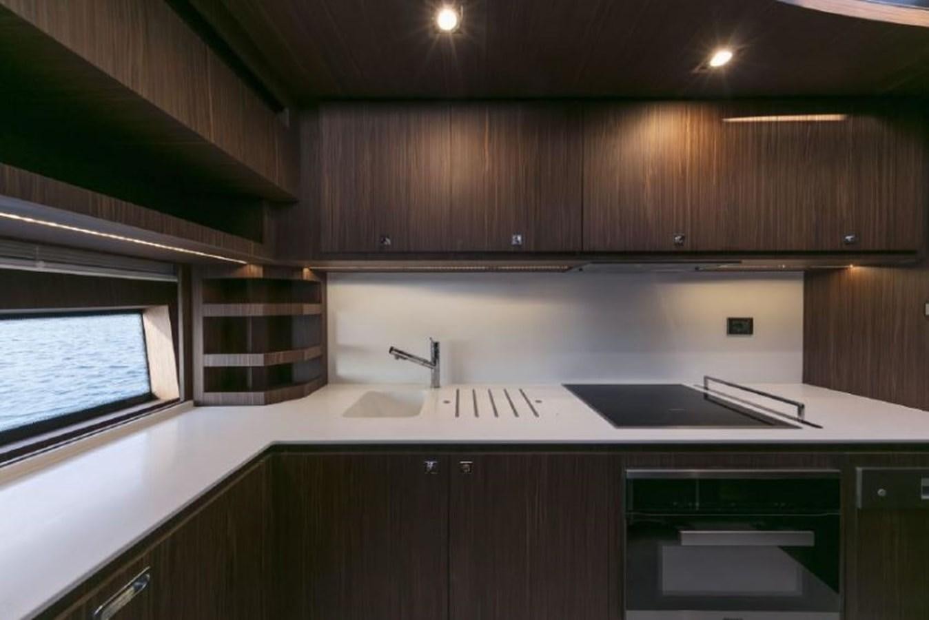 a kitchen with a sink and cabinets aboard OXIDANTE Yacht for Sale