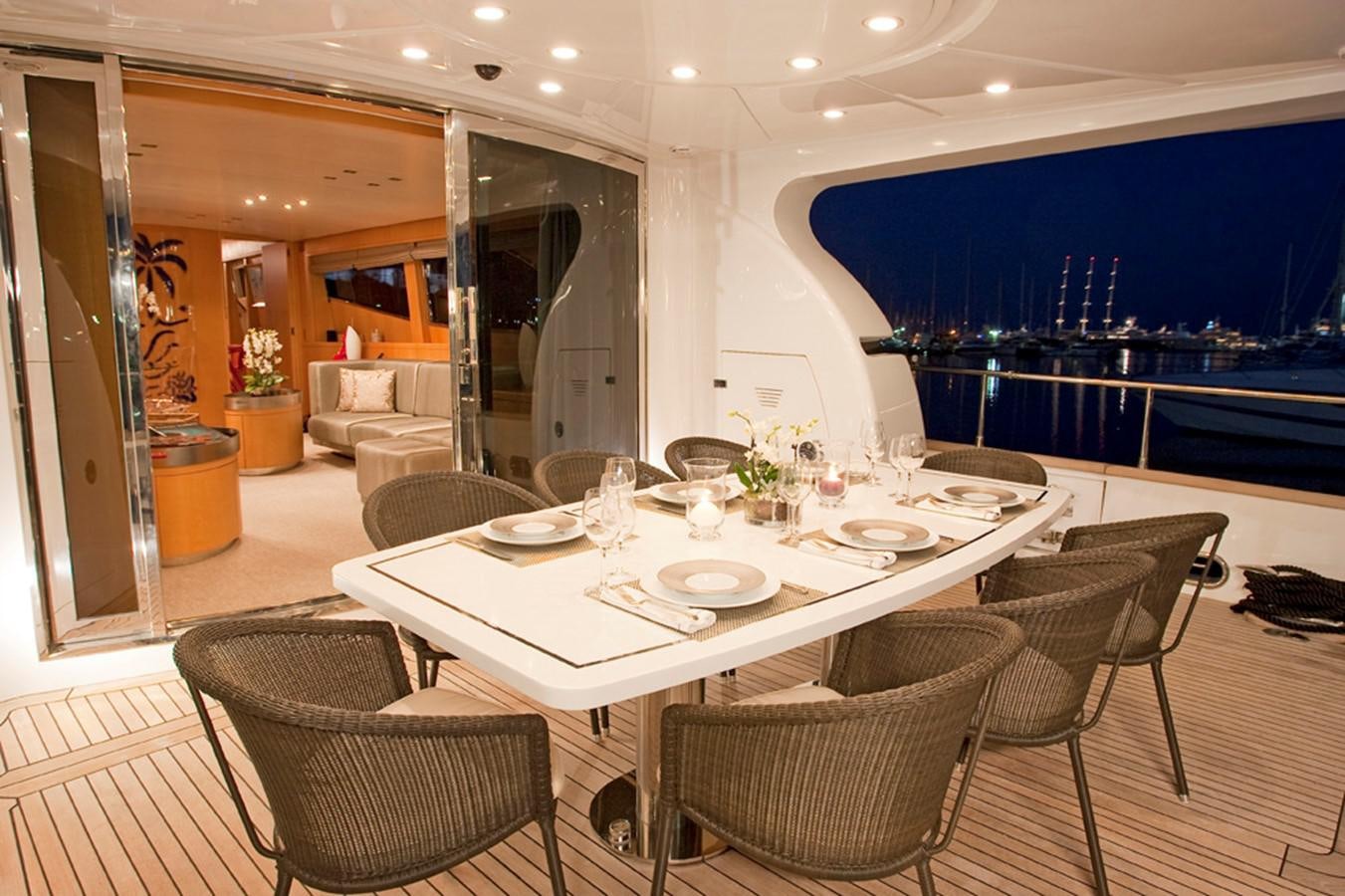a table set for a dinner aboard COCA VI Yacht for Sale