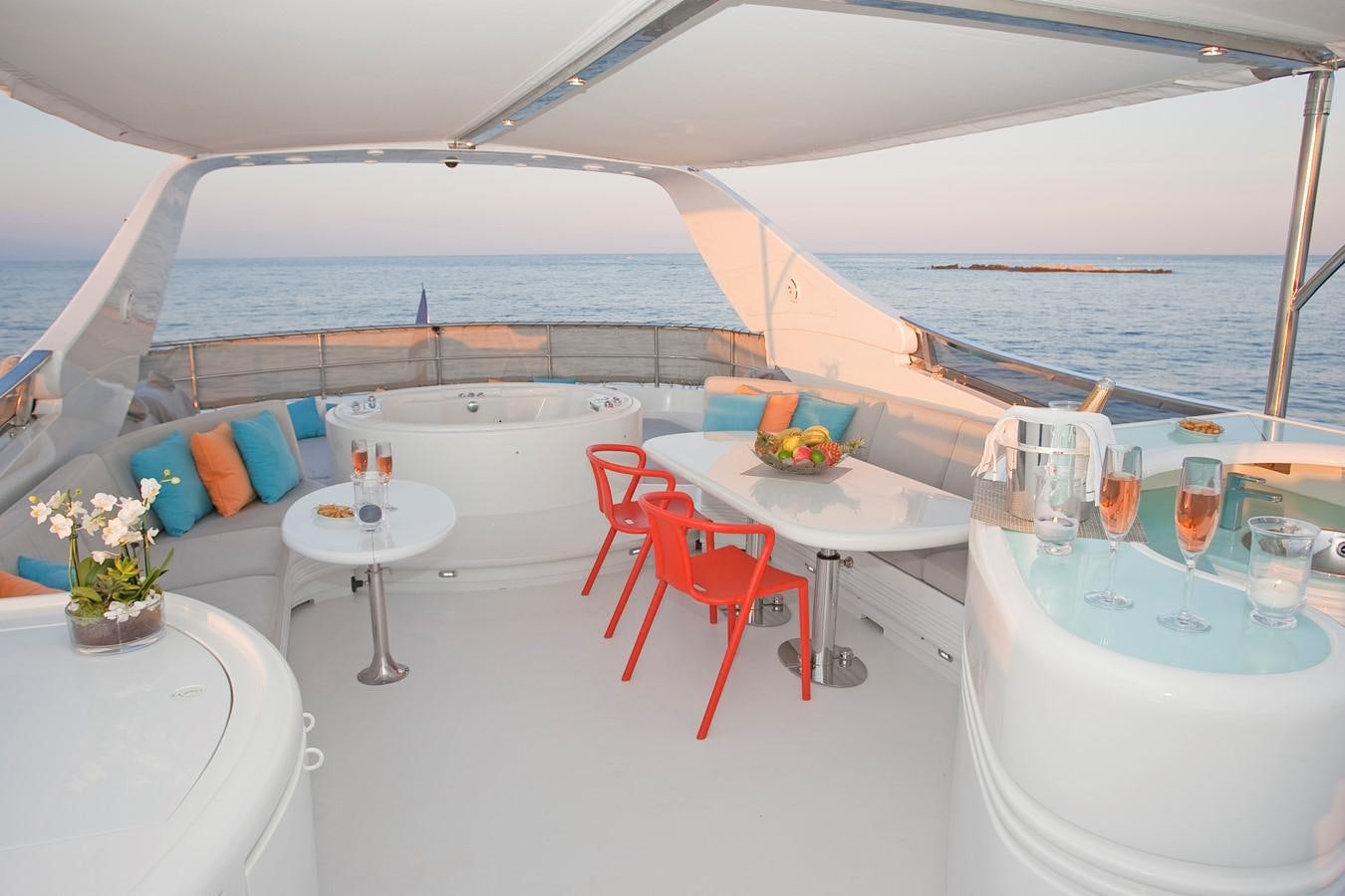 a table set for a meal on a boat aboard COCA VI Yacht for Sale