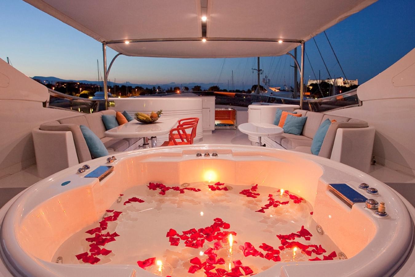 a large cake sits on a table aboard COCA VI Yacht for Sale
