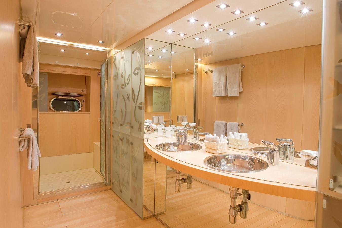 a bathroom with two sinks aboard COCA VI Yacht for Sale