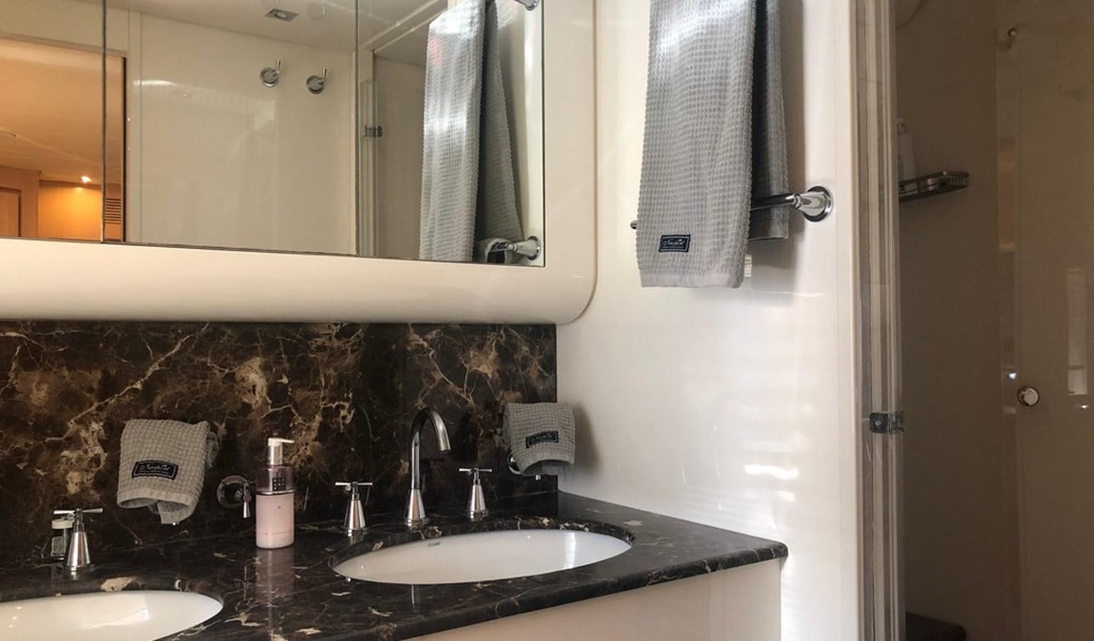 a bathroom with a sink and mirror aboard AYA Yacht for Sale