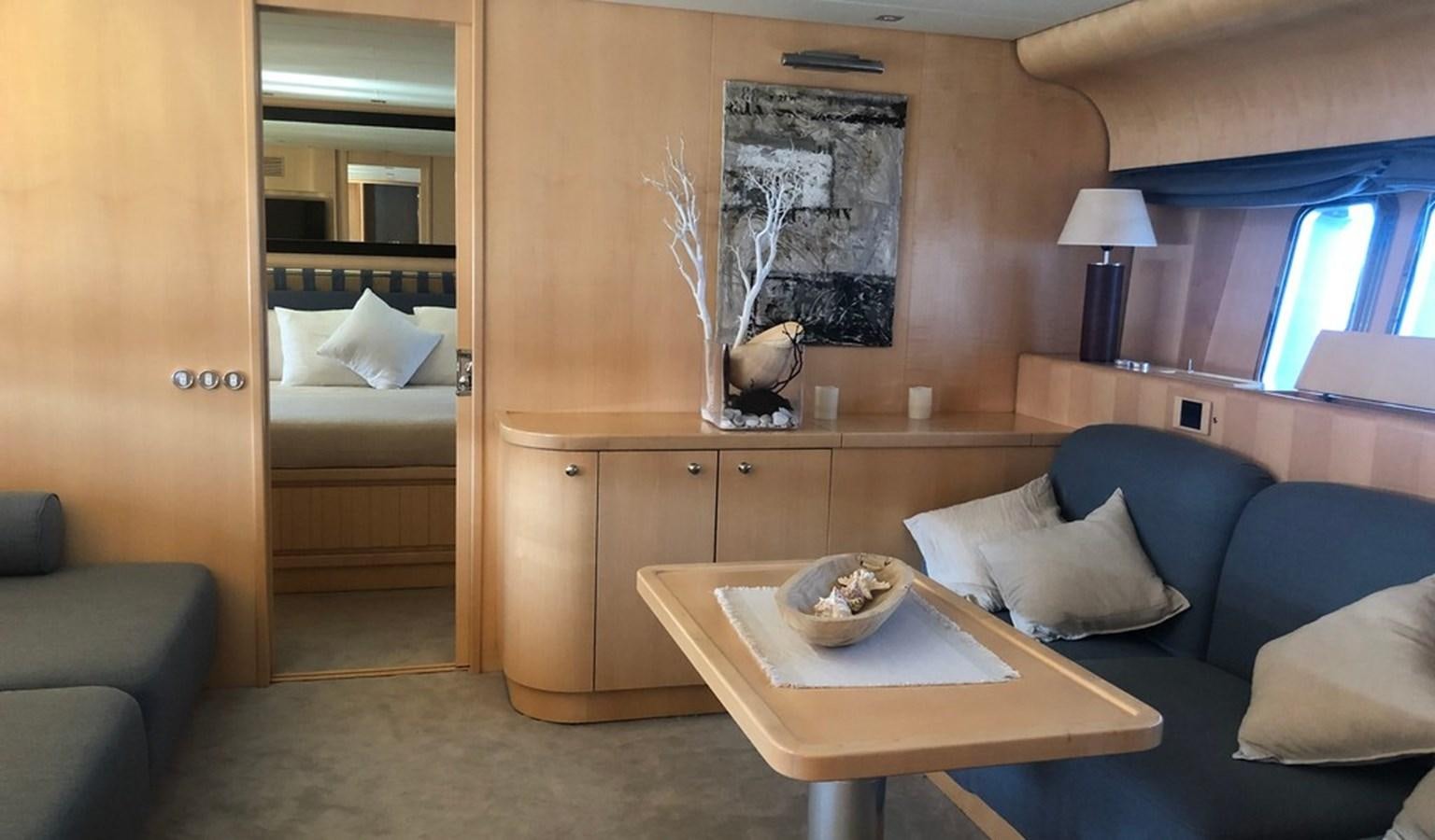 a living room with a couch and a coffee table aboard AYA Yacht for Sale