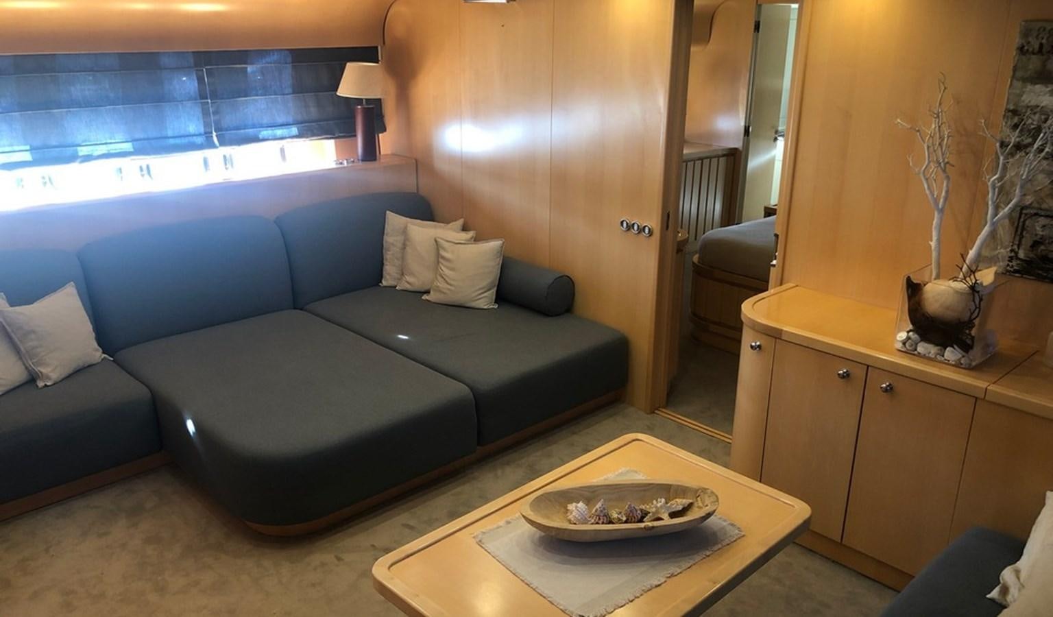 a living room with a couch and a coffee table aboard AYA Yacht for Sale