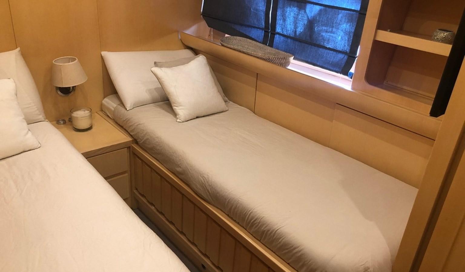 a bed with white sheets aboard AYA Yacht for Sale