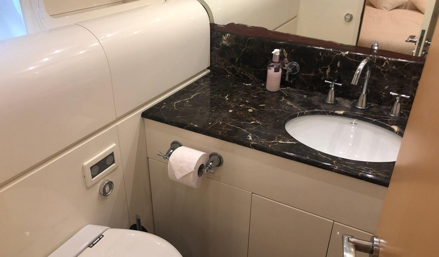 a bathroom with a sink and a toilet aboard AYA Yacht for Sale