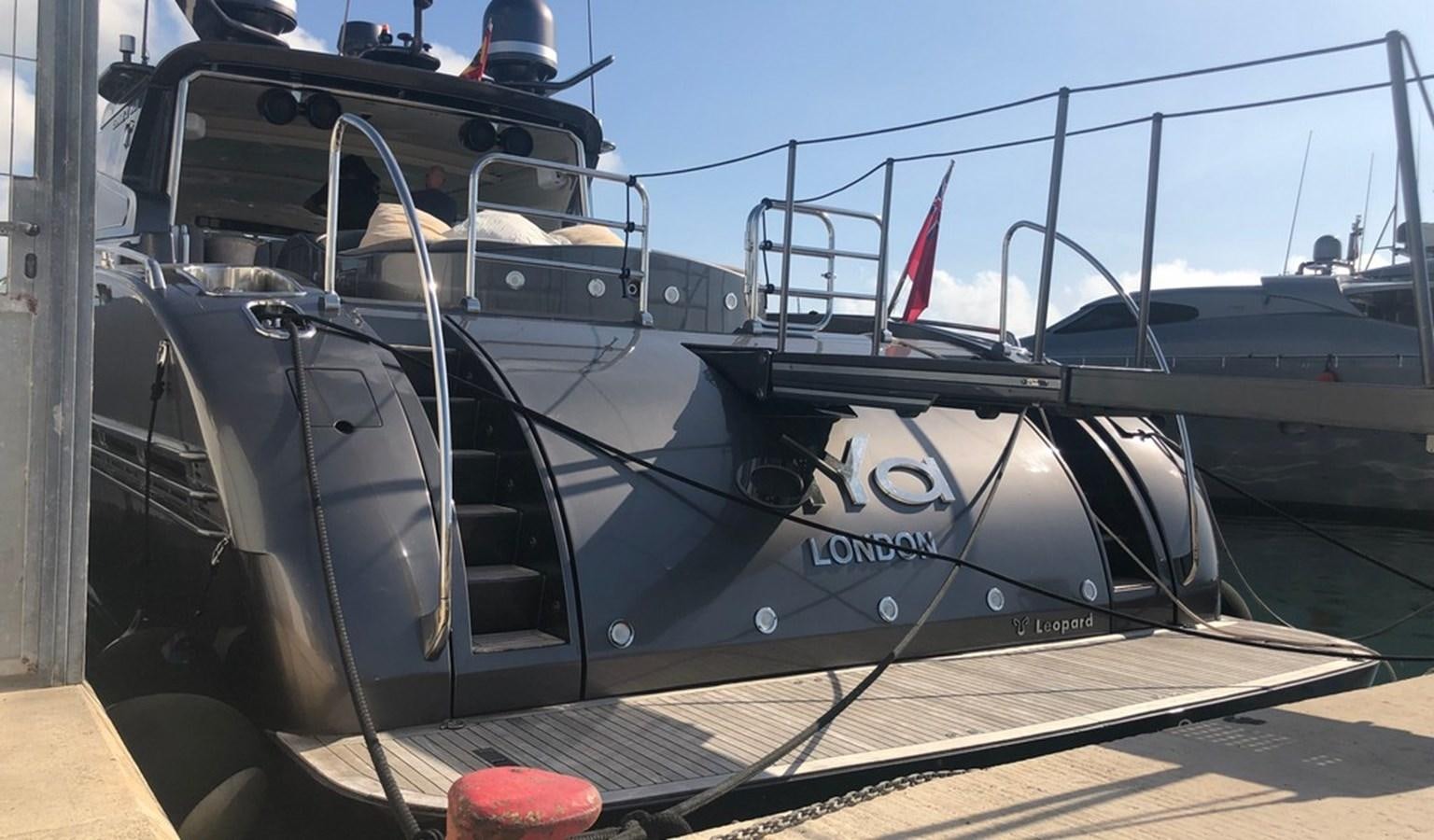 a black and white boat on a wooden deck aboard AYA Yacht for Sale