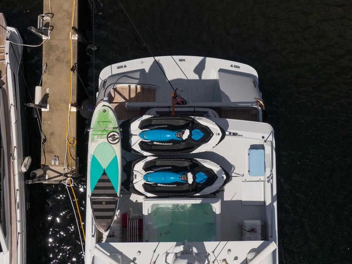 a white car with a blue and green interior aboard UNLEASHED Yacht for Sale