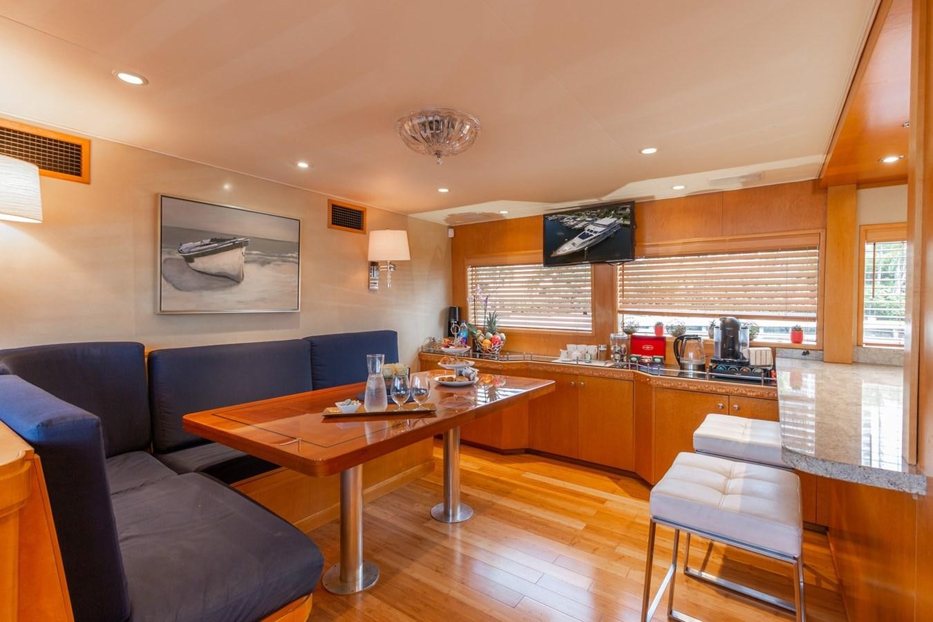 a large kitchen and living room aboard UNLEASHED Yacht for Sale