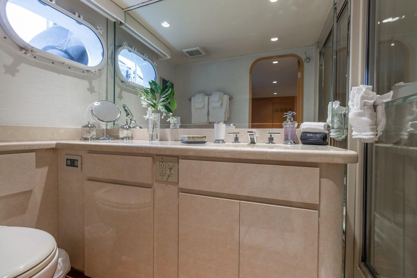 a bathroom with a large mirror aboard UNLEASHED Yacht for Sale