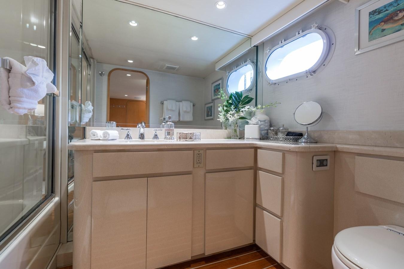 a bathroom with a large mirror aboard UNLEASHED Yacht for Sale