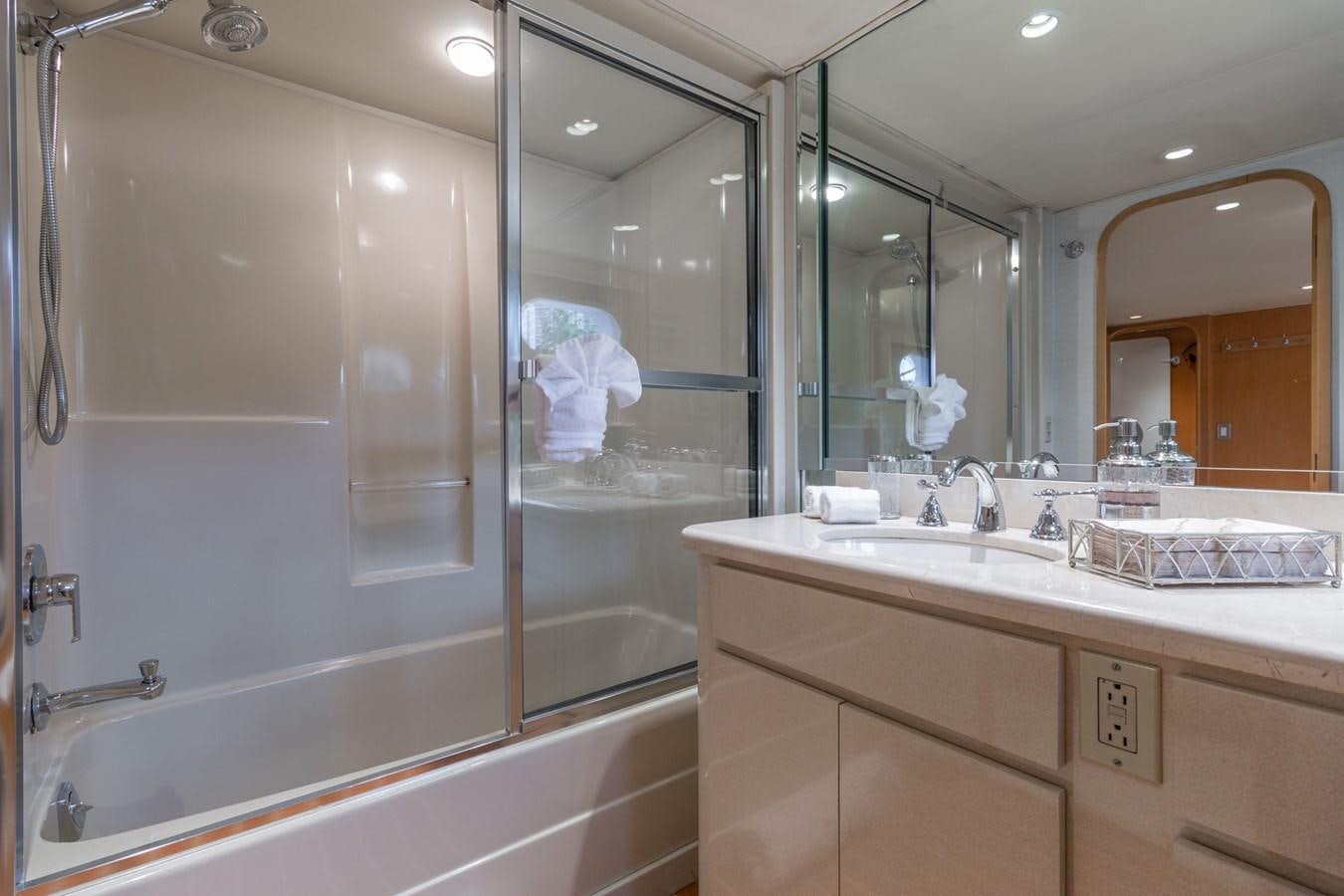 a bathroom with a large mirror aboard UNLEASHED Yacht for Sale