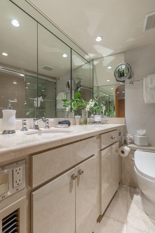 a bathroom with a large mirror aboard UNLEASHED Yacht for Sale