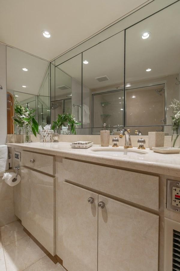 a bathroom with a large mirror aboard UNLEASHED Yacht for Sale