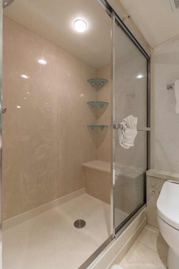 a bathroom with a glass shower aboard UNLEASHED Yacht for Sale