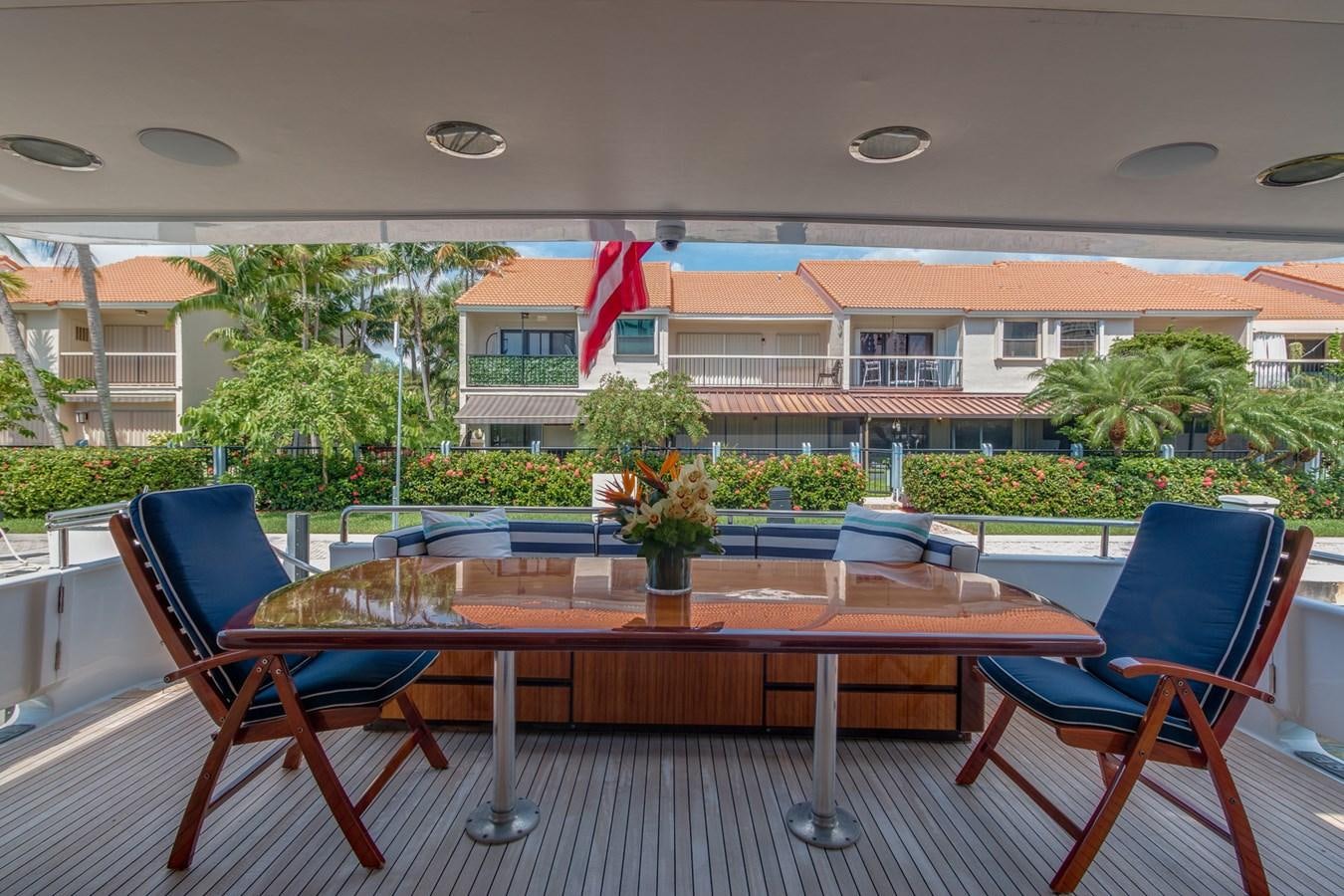 a table and chairs in front of a building aboard UNLEASHED Yacht for Sale