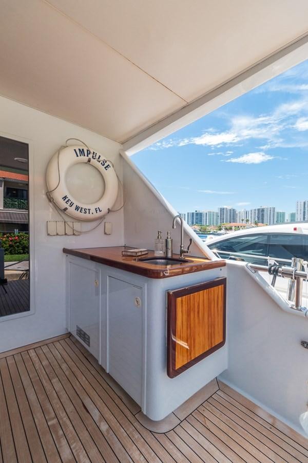 a kitchen with a sink and a window aboard UNLEASHED Yacht for Sale