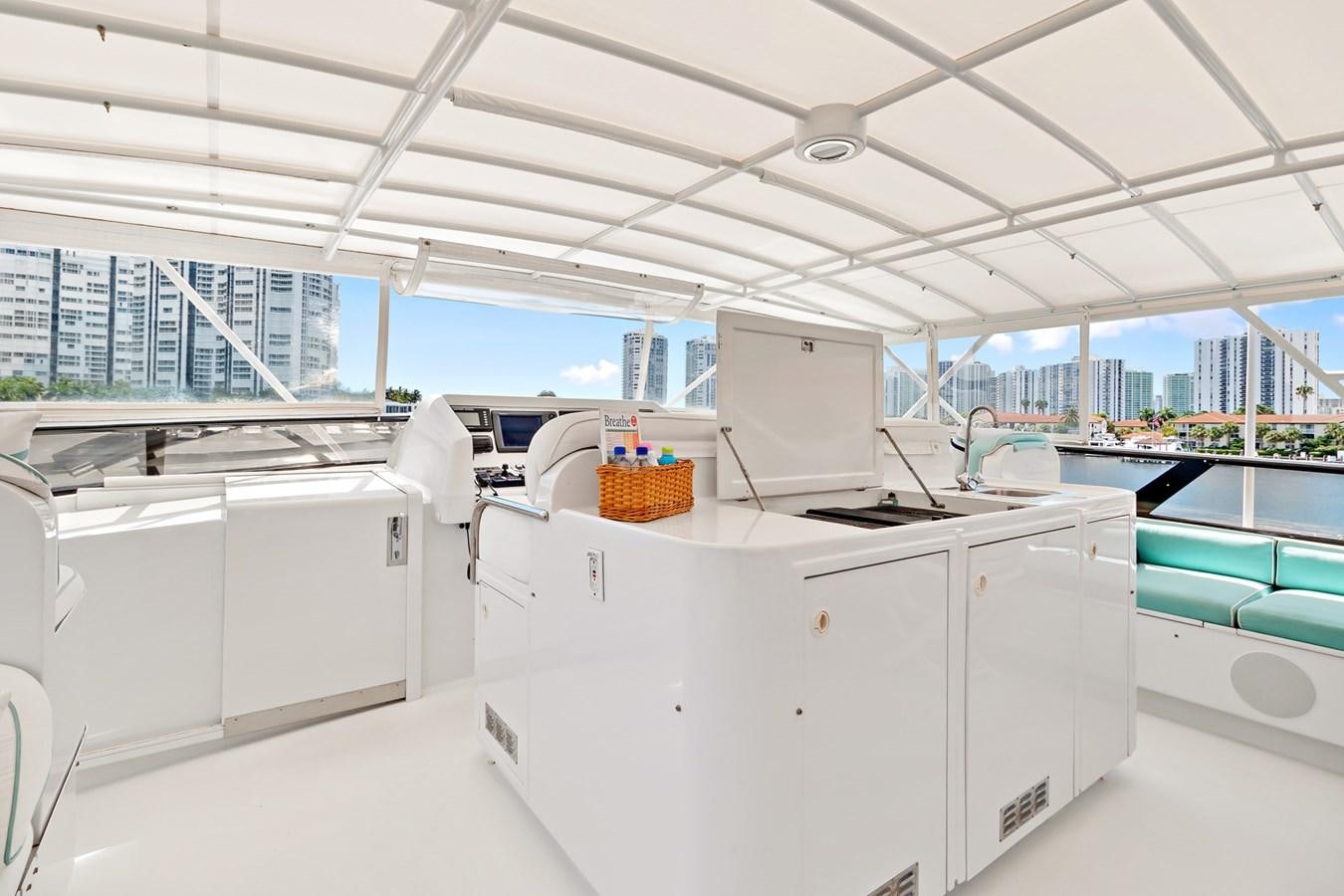 a room with white cabinets and a computer on a desk aboard UNLEASHED Yacht for Sale