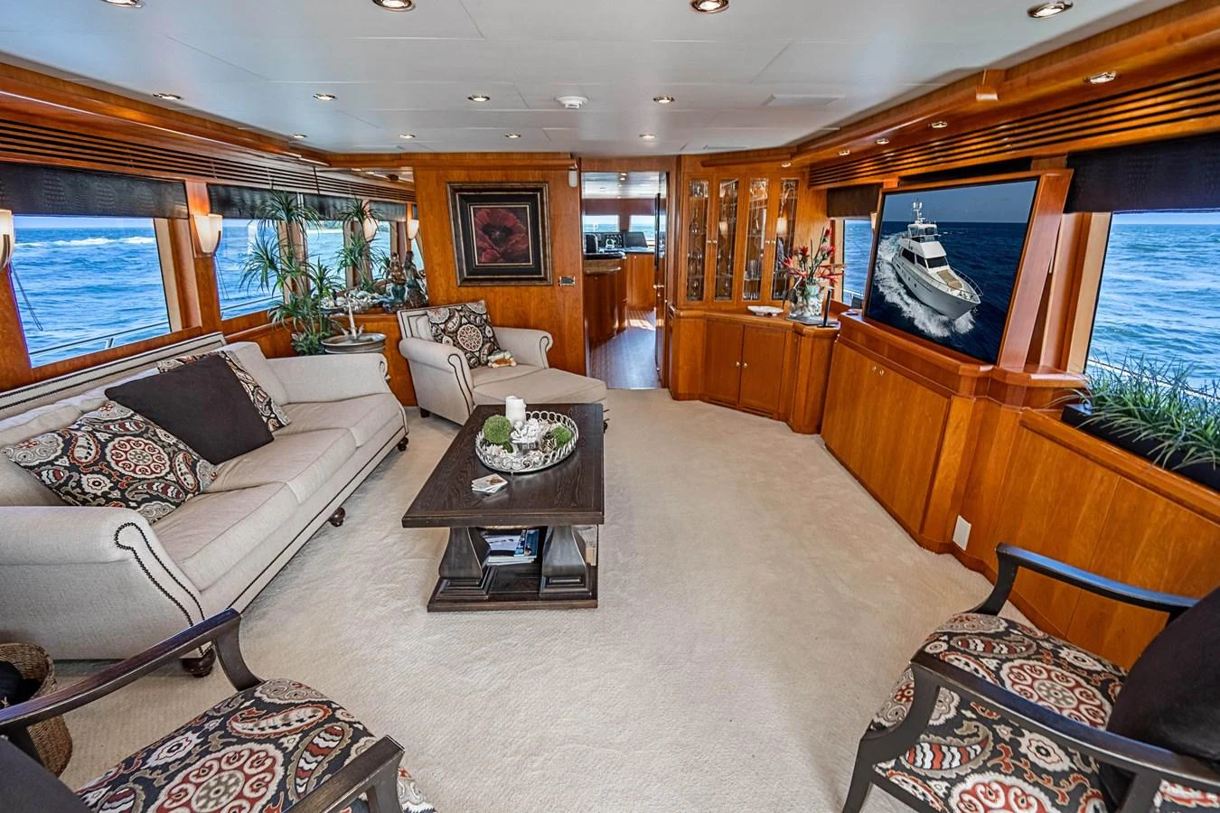 a living room with a large window aboard ROXY MARIA Yacht for Sale