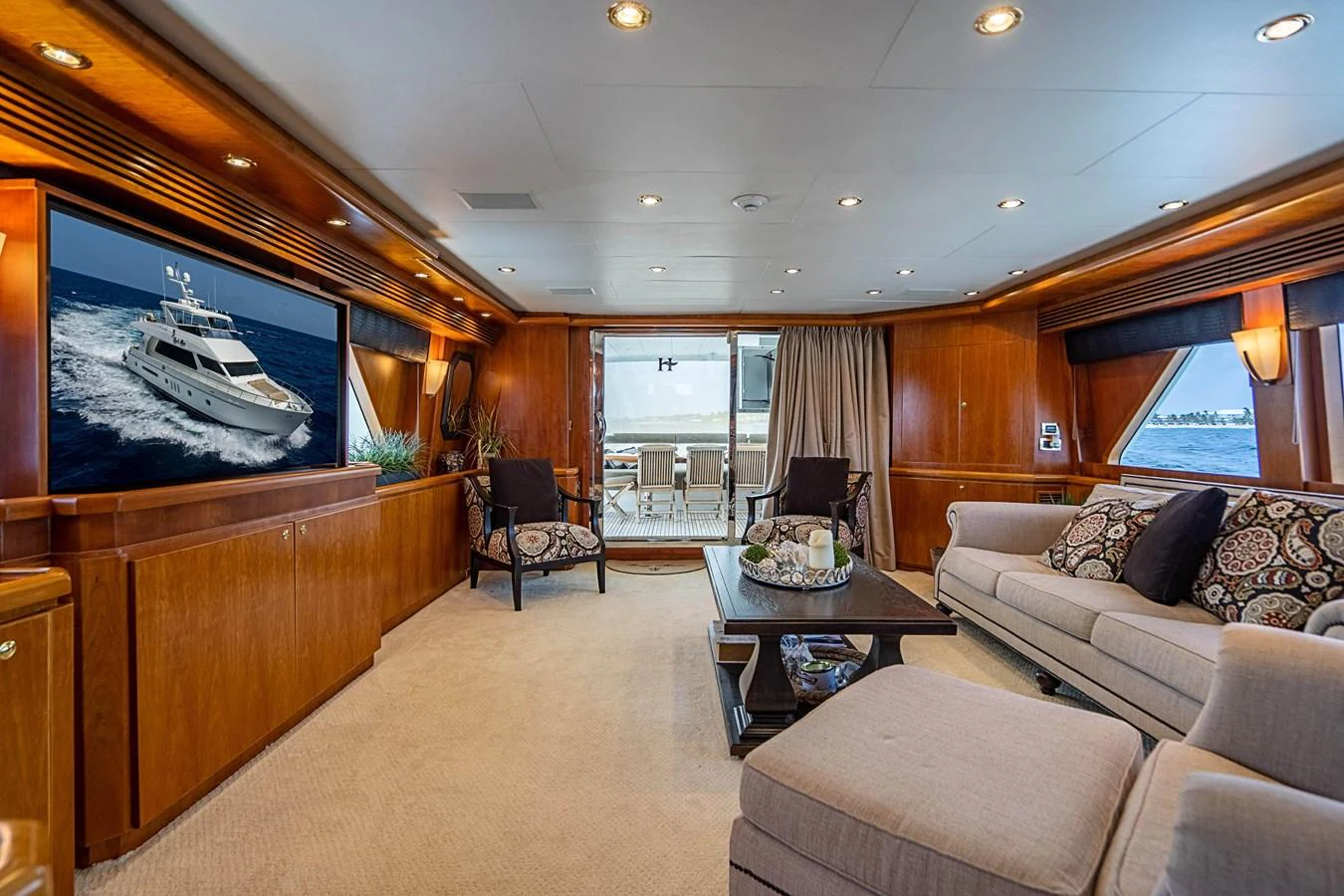 a living room with a large screen aboard ROXY MARIA Yacht for Sale