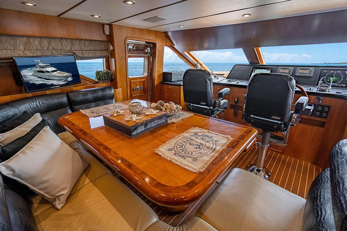 a room with a table and chairs aboard ROXY MARIA Yacht for Sale