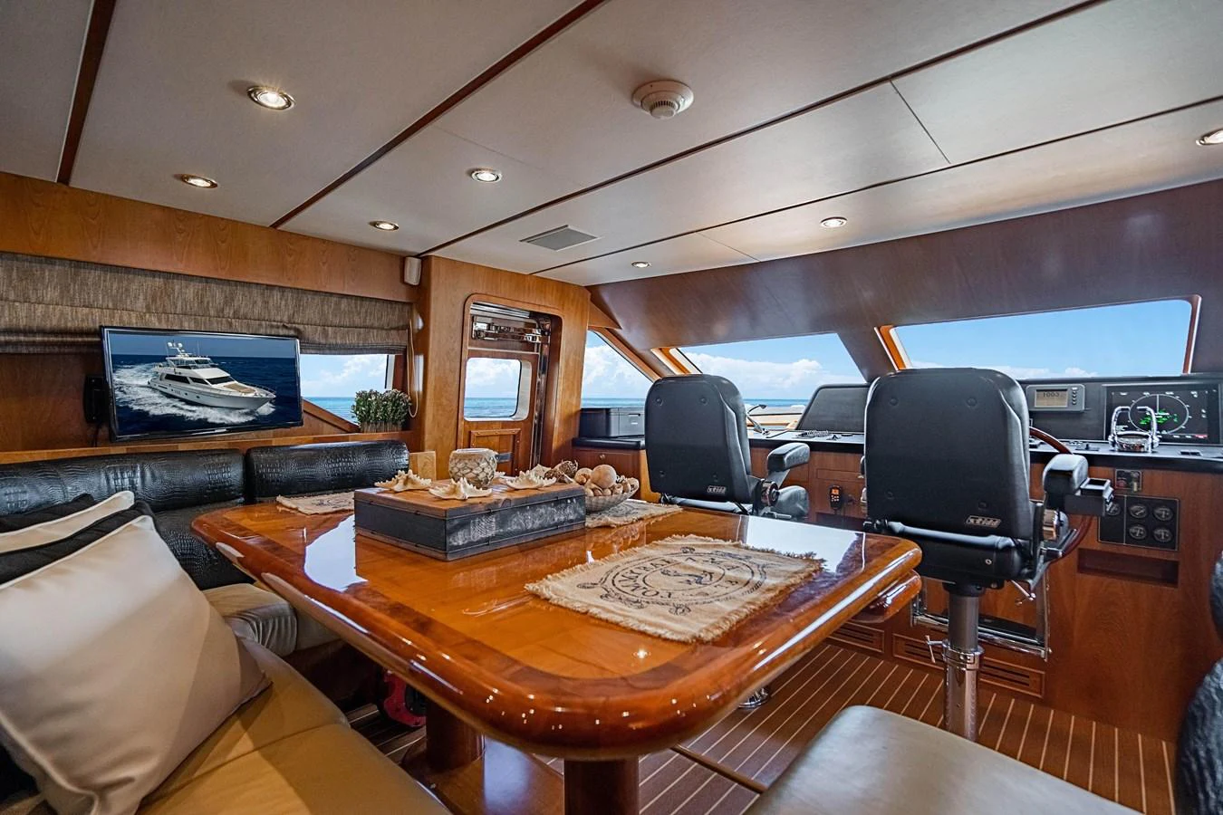a room with a table and chairs aboard ROXY MARIA Yacht for Sale