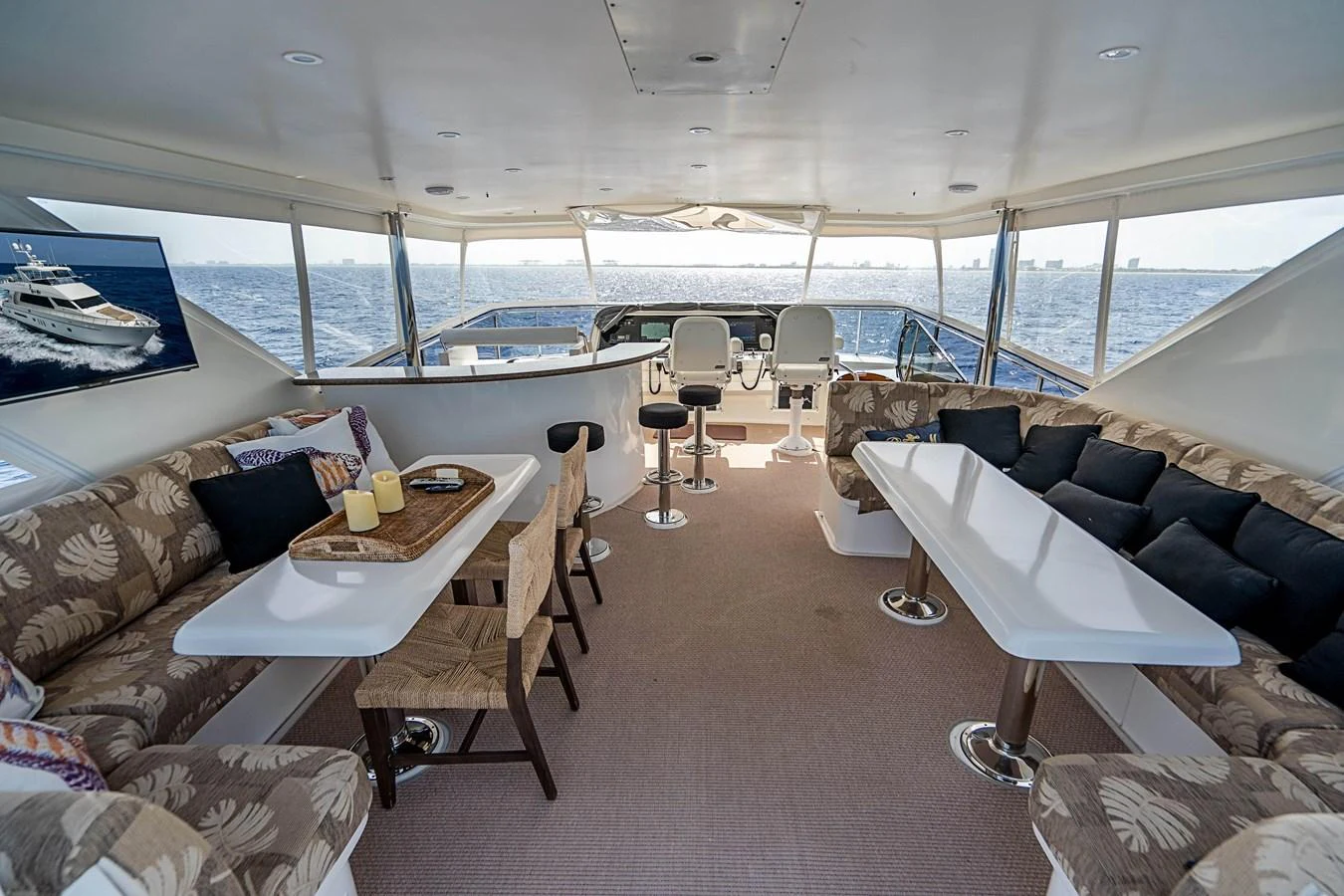 a living room with a large window aboard ROXY MARIA Yacht for Sale