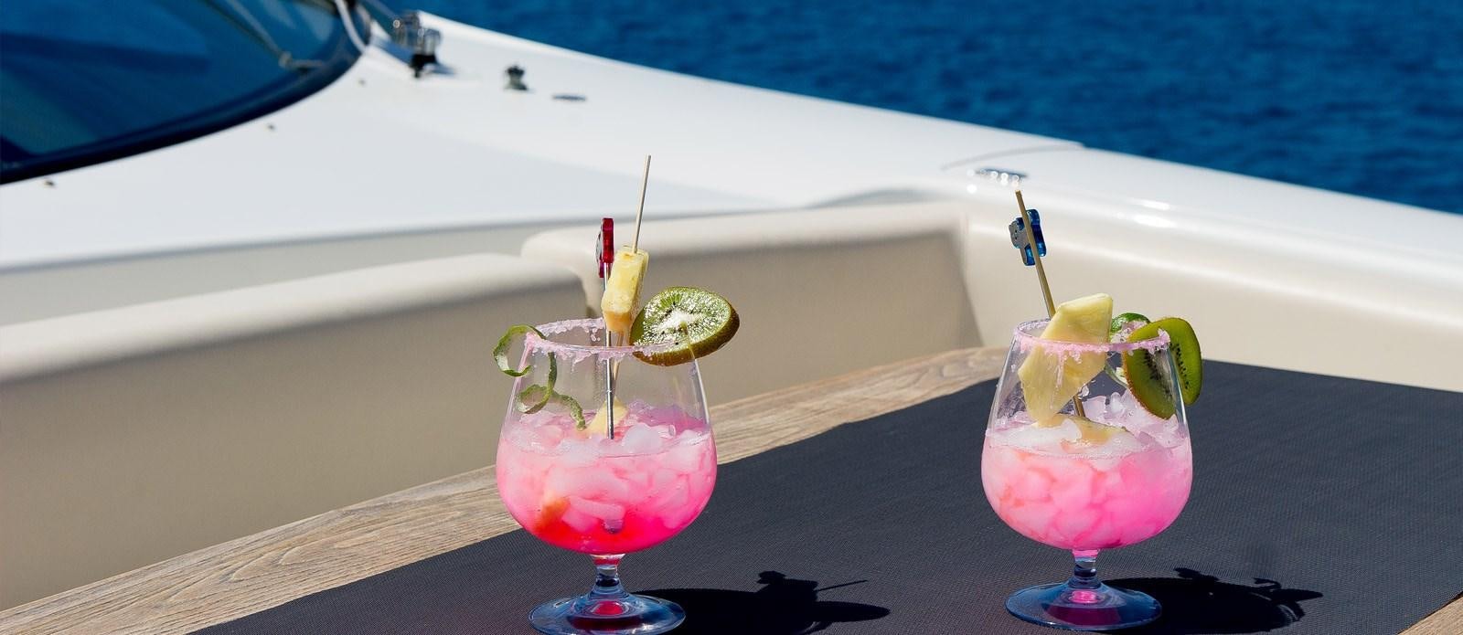 a couple of drinks on a boat aboard NEMESIS Yacht for Sale
