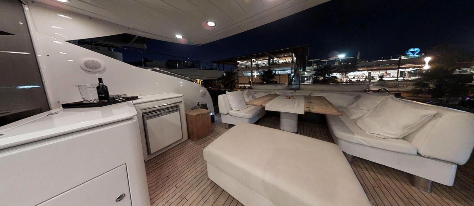 a room with a couch and a table and a bed aboard NEMESIS Yacht for Sale