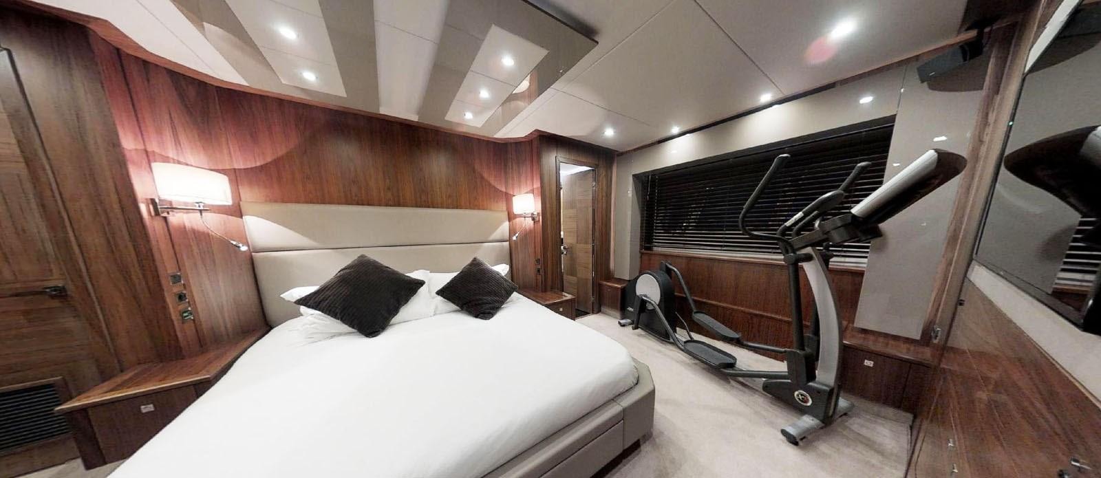 a room with a bed and a ladder aboard NEMESIS Yacht for Sale