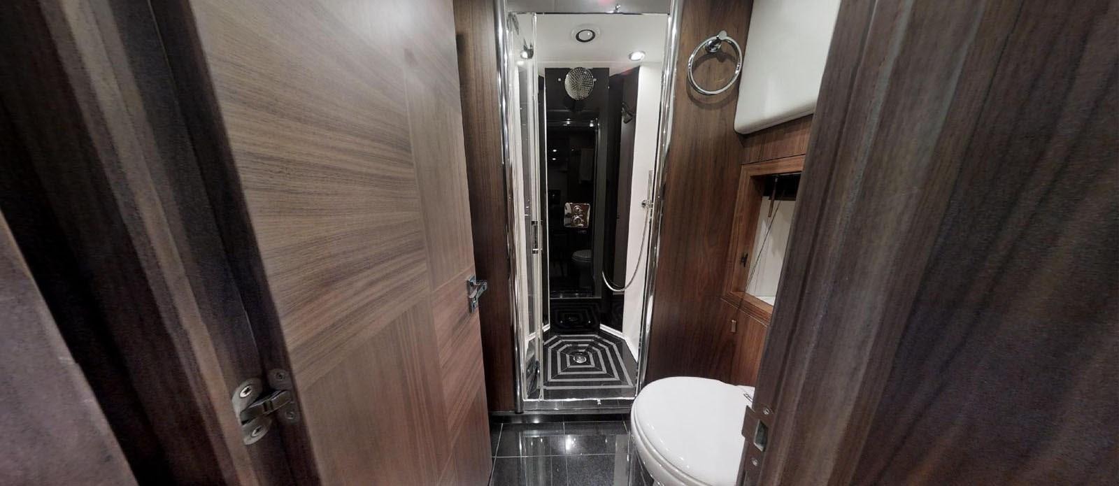 a bathroom with a glass door aboard NEMESIS Yacht for Sale