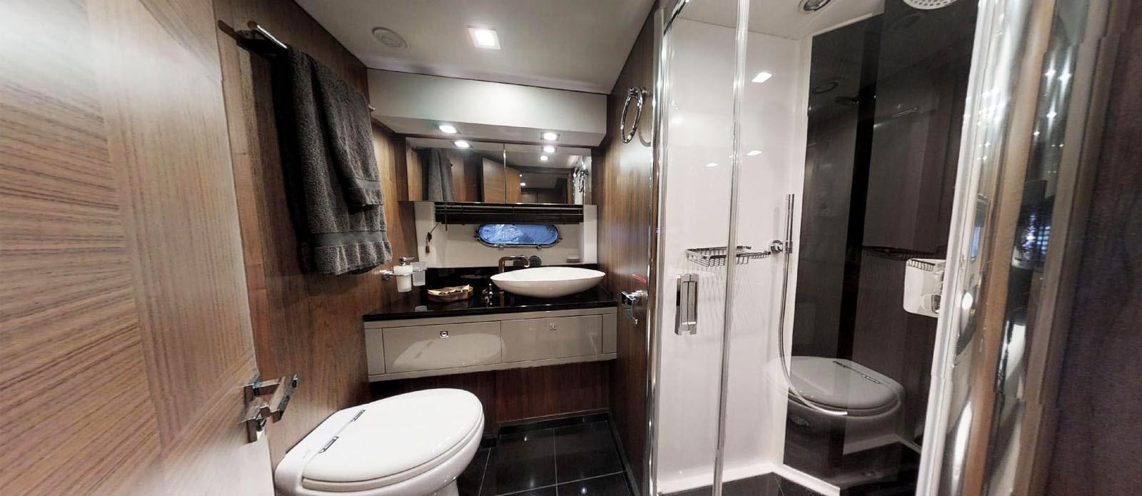 a bathroom with a sink toilet and a shower aboard NEMESIS Yacht for Sale