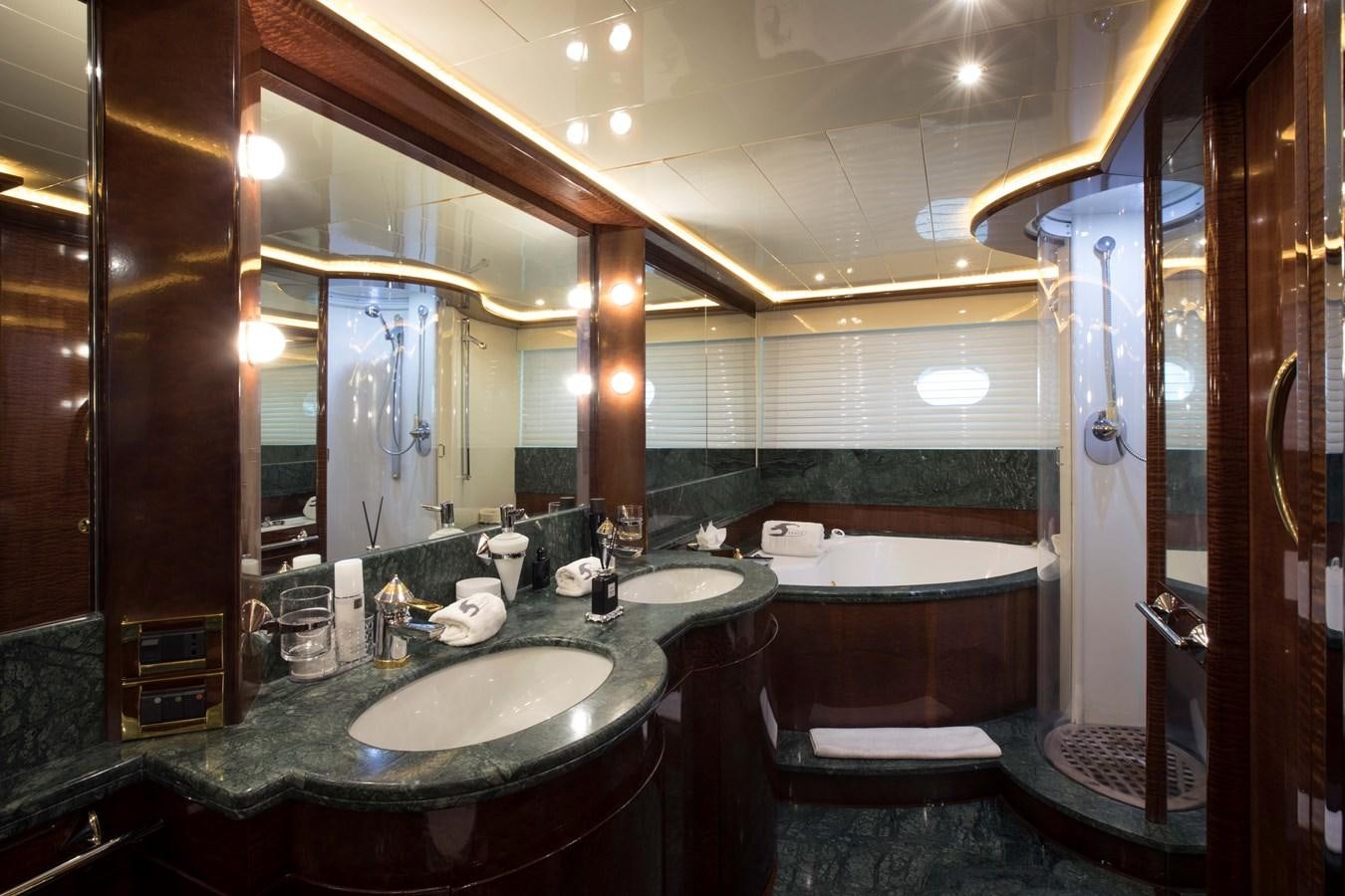 a bathroom with a large mirror aboard SERAPH Yacht for Sale
