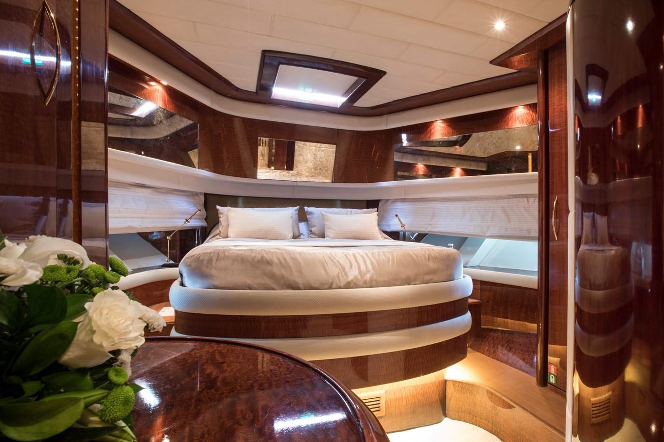 a room with a bed and a table aboard SERAPH Yacht for Sale