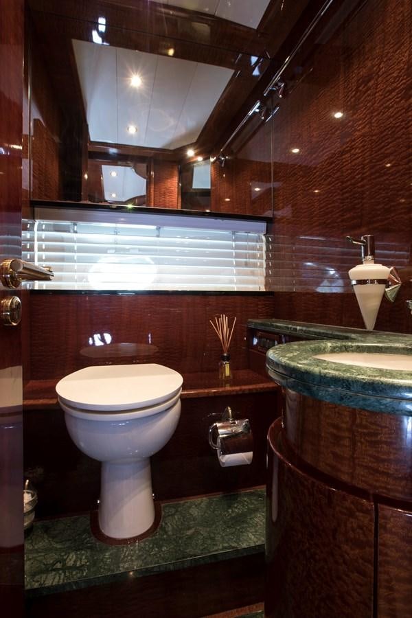 a bathroom with a toilet and a sink aboard SERAPH Yacht for Sale