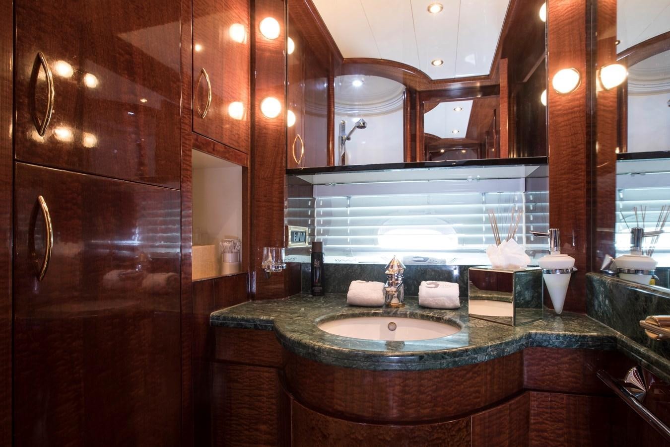a bathroom with a large mirror aboard SERAPH Yacht for Sale