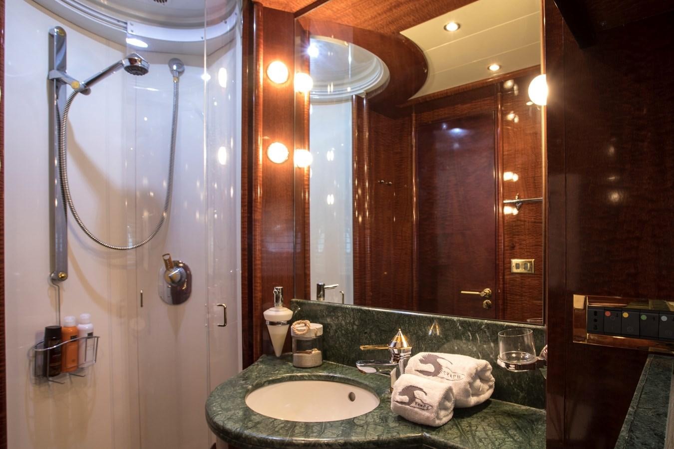 a bathroom with a large mirror aboard SERAPH Yacht for Sale