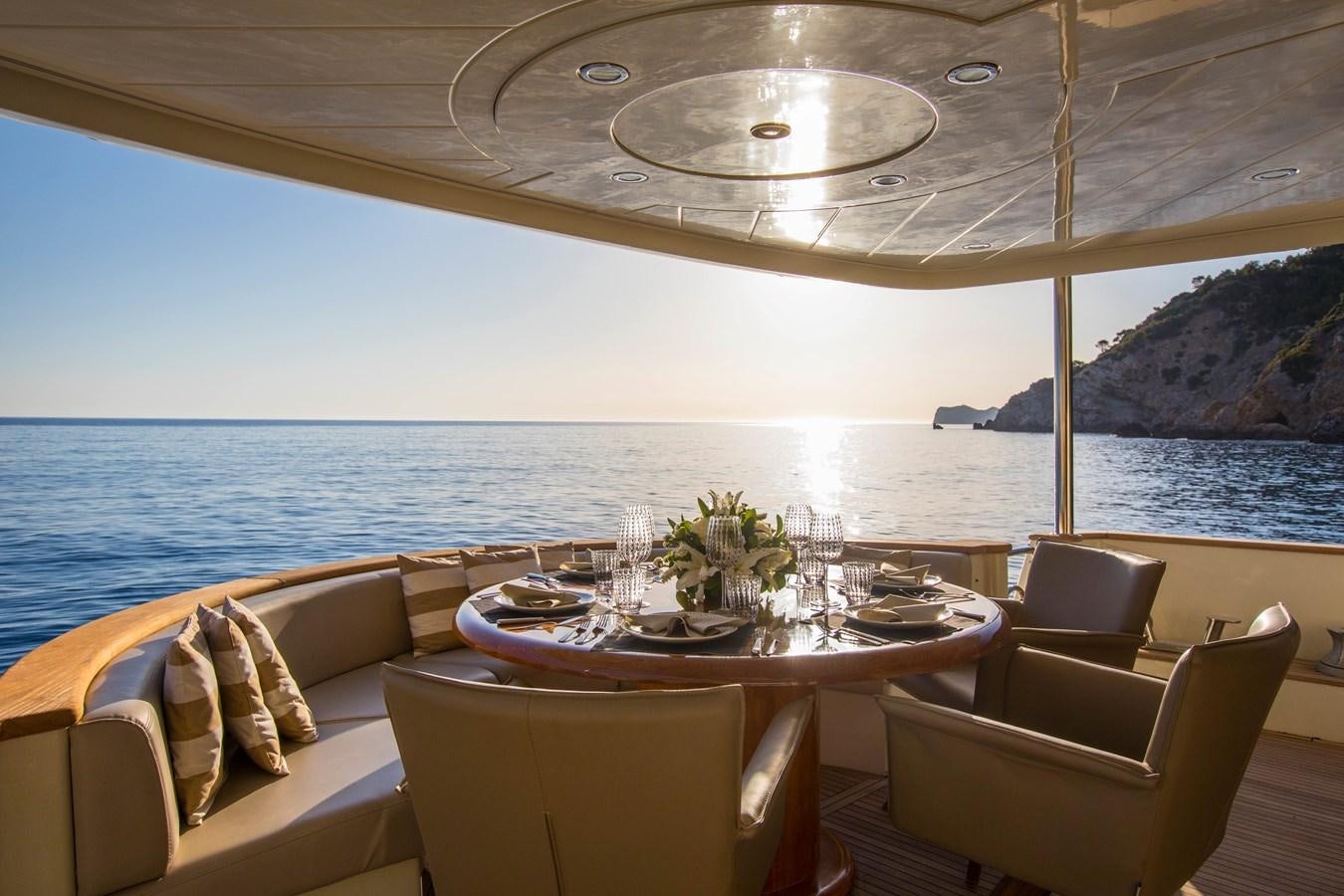 a table set for a meal on a boat aboard SERAPH Yacht for Sale