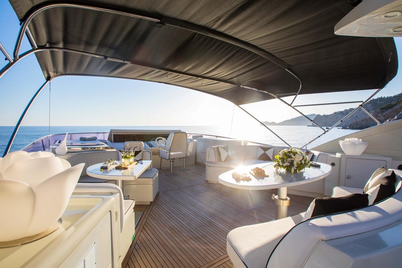 a boat with a table and chairs aboard SERAPH Yacht for Sale