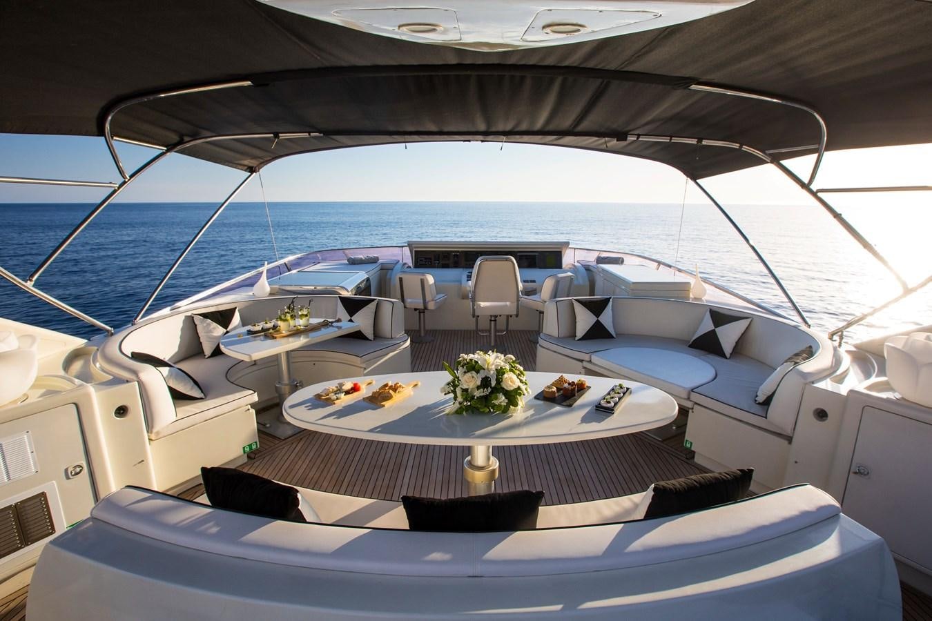 a boat with a table set for a dinner party aboard SERAPH Yacht for Sale