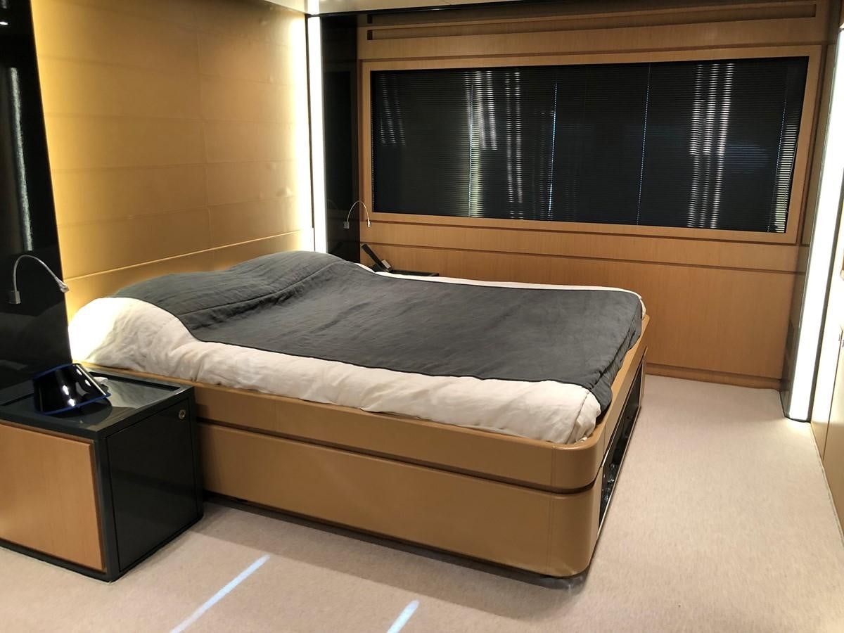 a bed in a room aboard RIVA 86 Yacht for Sale