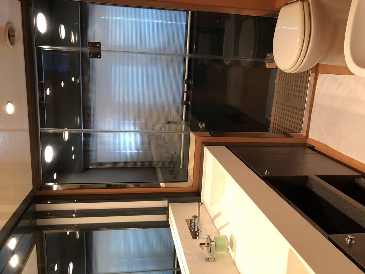 a kitchen with a large window aboard RIVA 86 Yacht for Sale