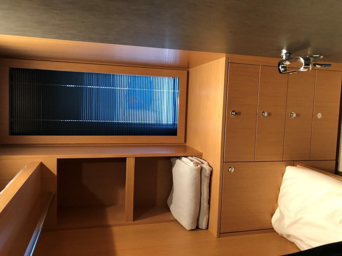 a room with a tv and a bed aboard RIVA 86 Yacht for Sale