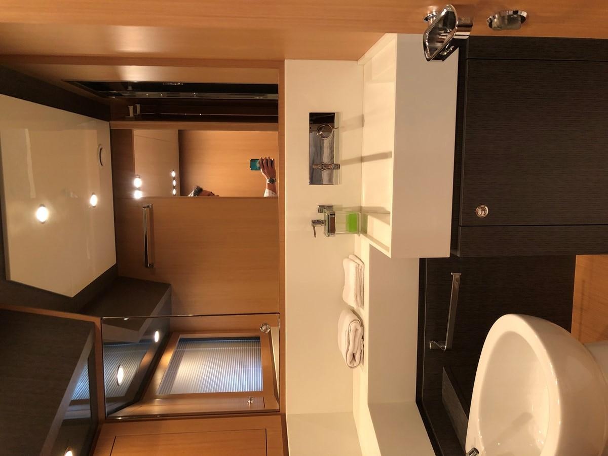 a room with a sink and cabinets aboard RIVA 86 Yacht for Sale