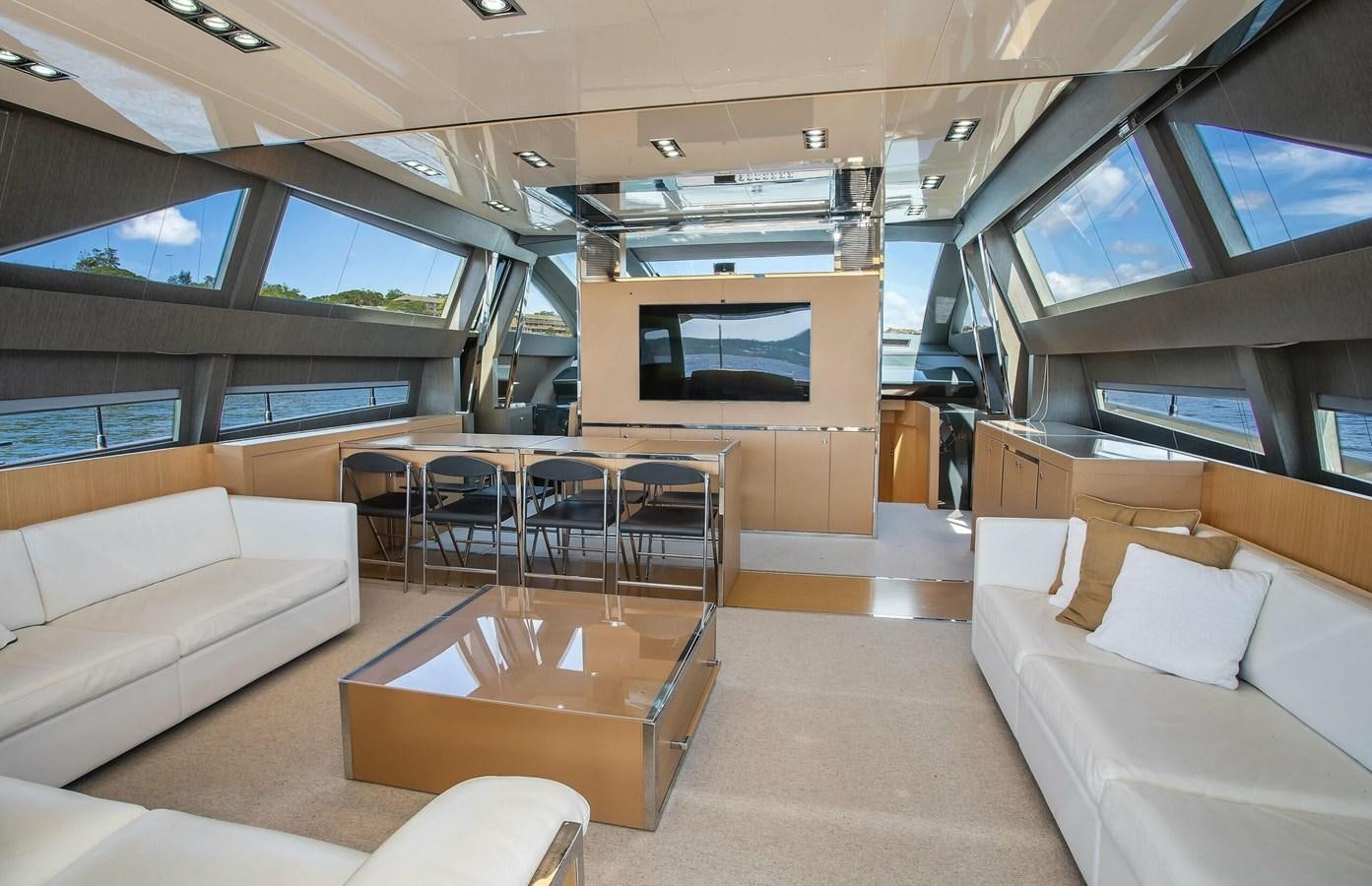 a room with a couch and a table and chairs aboard RIVA 88 DOMINO Yacht for Sale