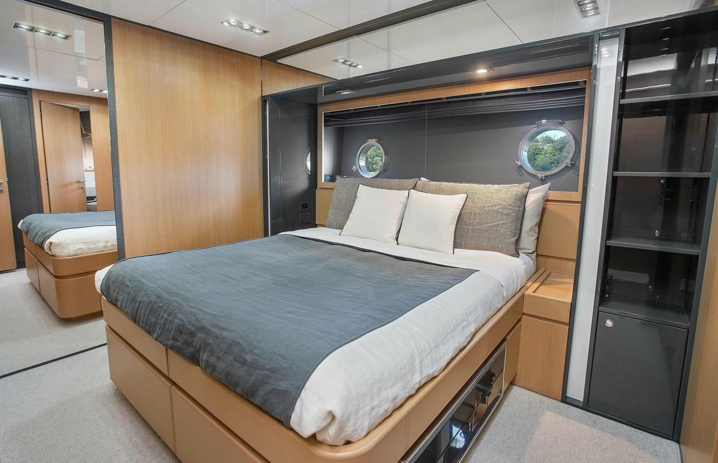 a bed in a room aboard RIVA 88 DOMINO Yacht for Sale